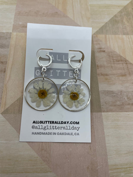 Pressed white daisy flower in resin circle dangle earring